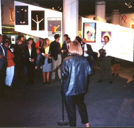 Opening of the poster art exhibition, visitors viewing framed posters