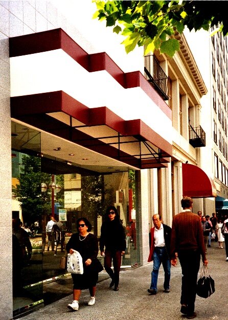 A renovated K Street storefront with striped awnings