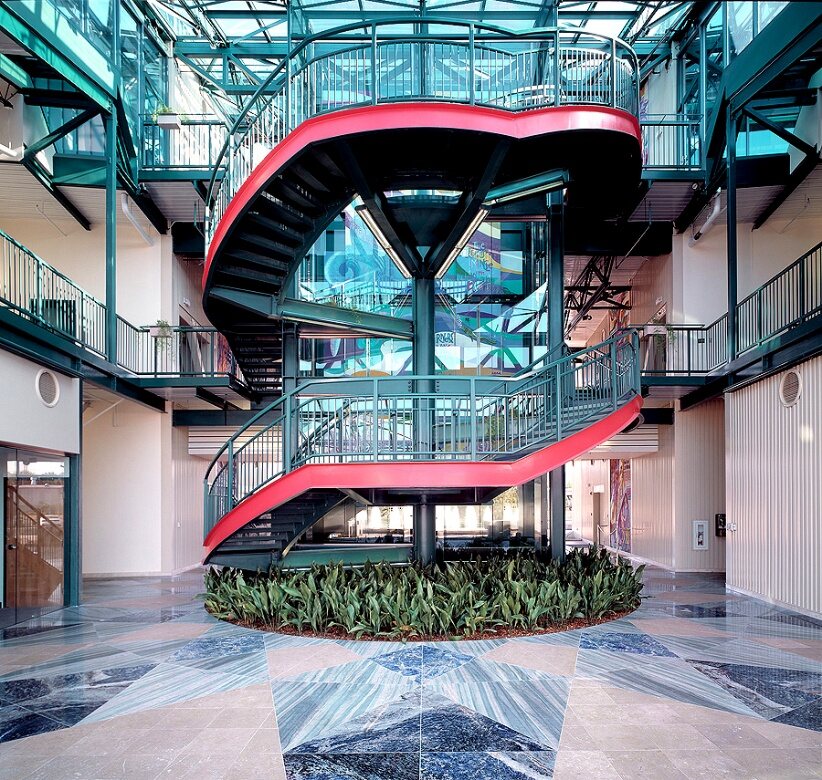The red central stair in the entry lobby