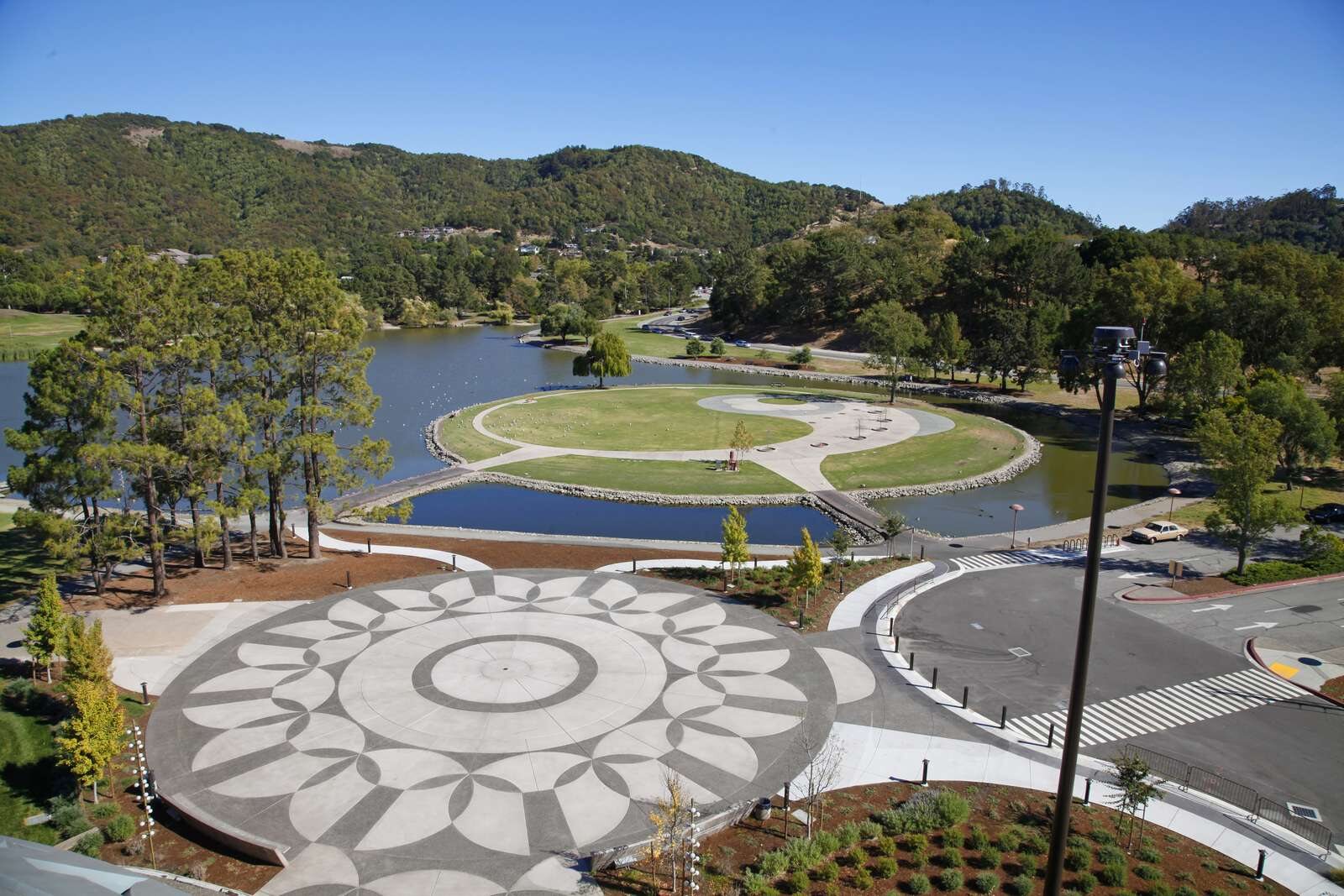 Aerial view of the Veterans' Plaza with the lagoon and hills