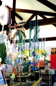 A classroom with hanging student artwork